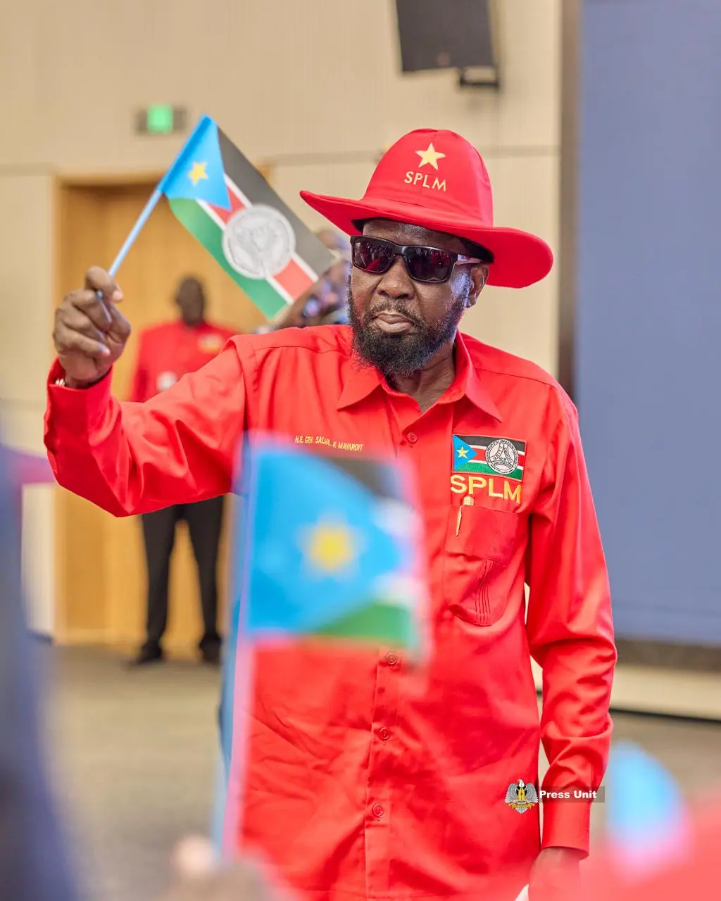 Chairman Salva Kiir Mayardit waving the SPLM flag