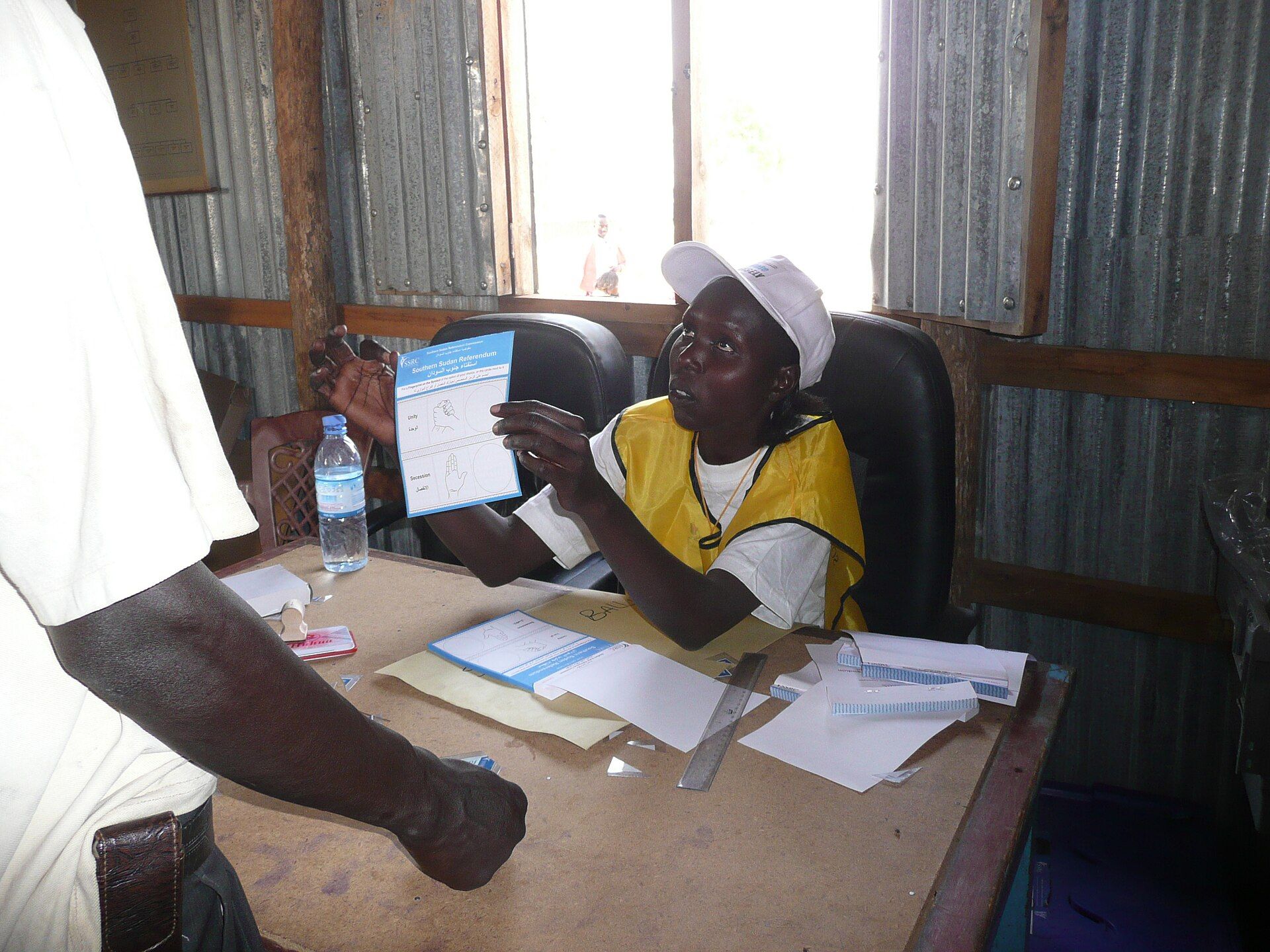 A polling centre official explains the voting procedure during the 2011 referendum in Juba