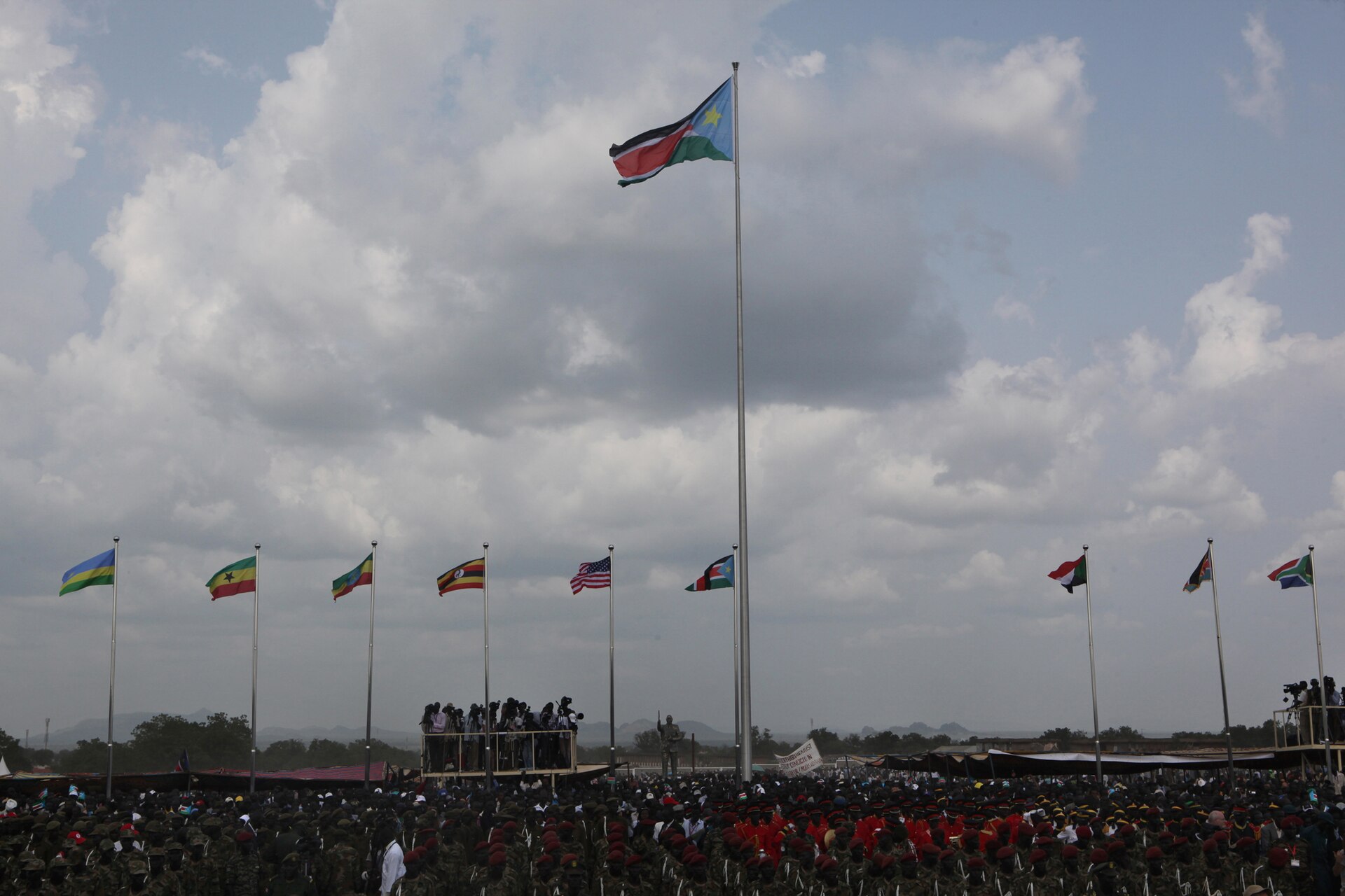 Crowds under the newly raised flag of South Sudan, 9 July 2011